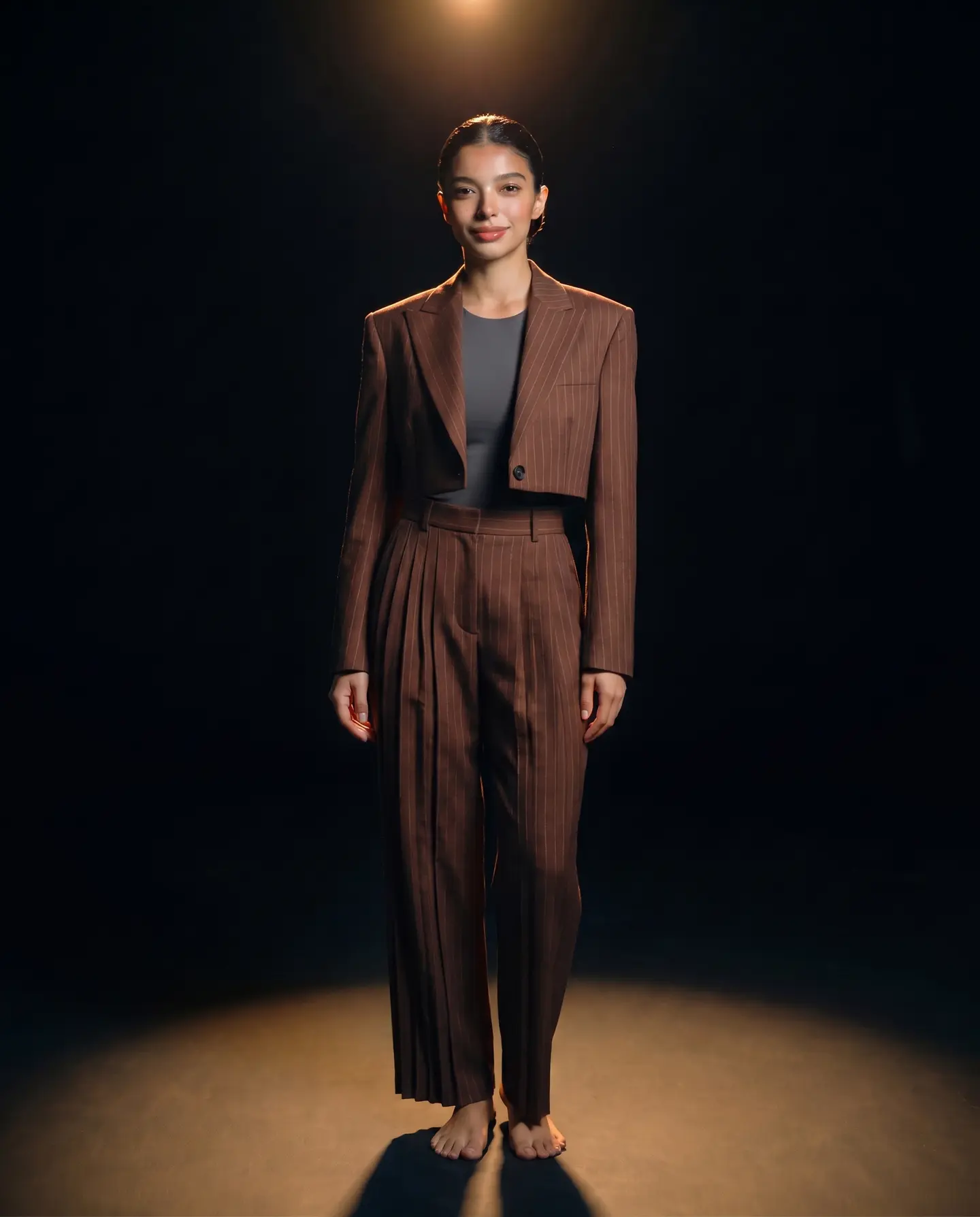 The same woman wearing the espresso pinstripe suit